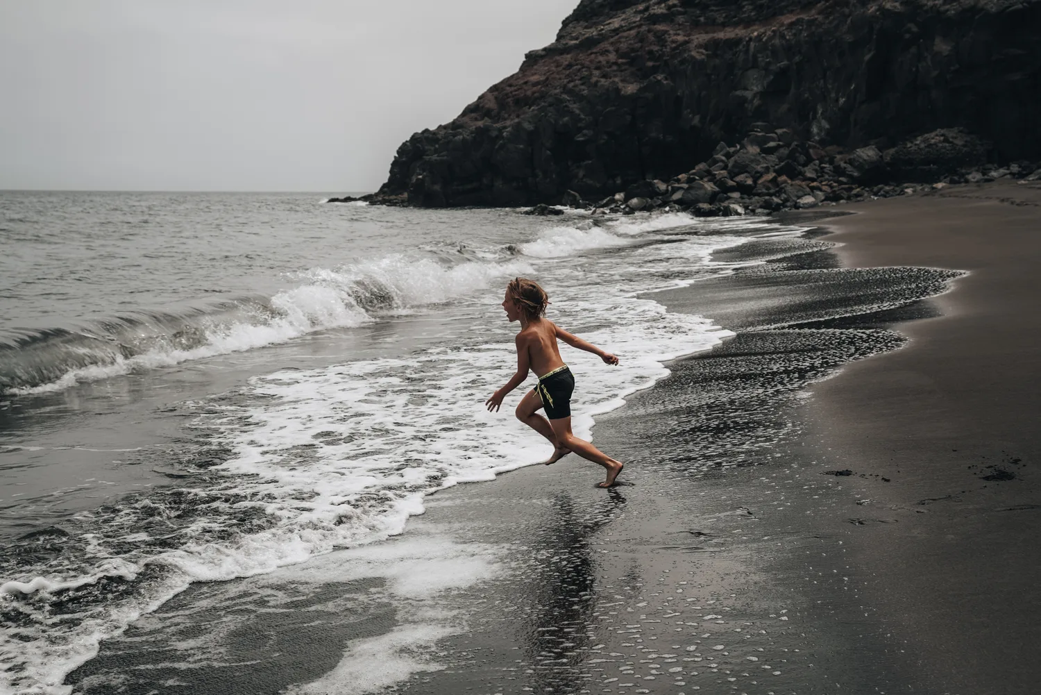 Dark sand and Atlantic waves along Lanzarote’s volcanic coast